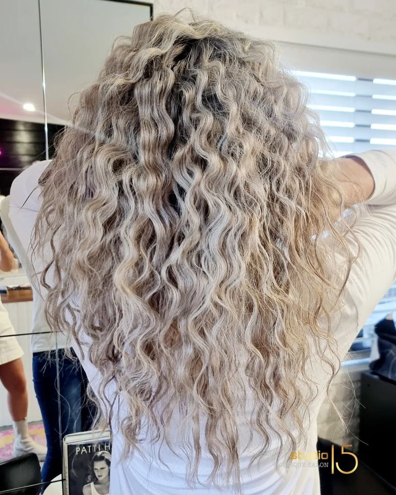 Blonde curly hair styling at Studio 15 boutique salon Northland