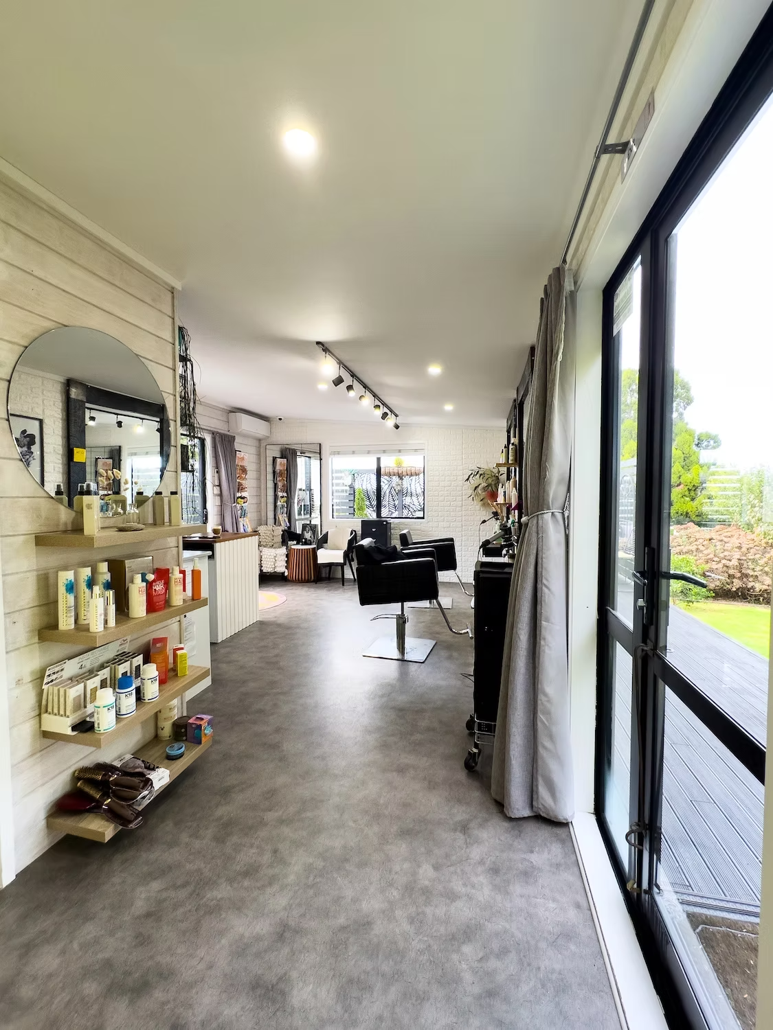 Studio 15 salon interior showcasing low-tox hair products and styling chairs
